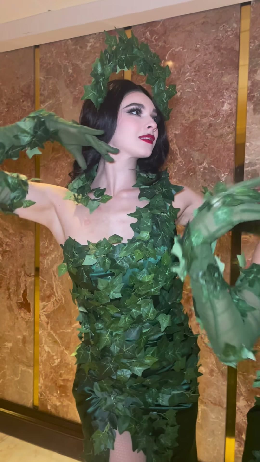 Ivy enchantress performer in living botanical costume with leaves at a New York City event