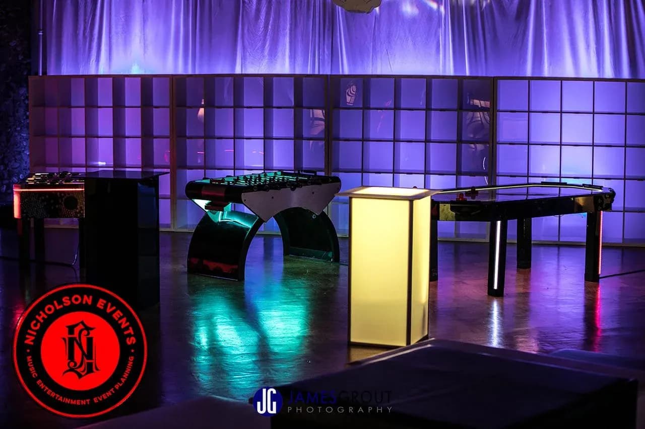 Purple-lit lounge with LED furniture and LED games