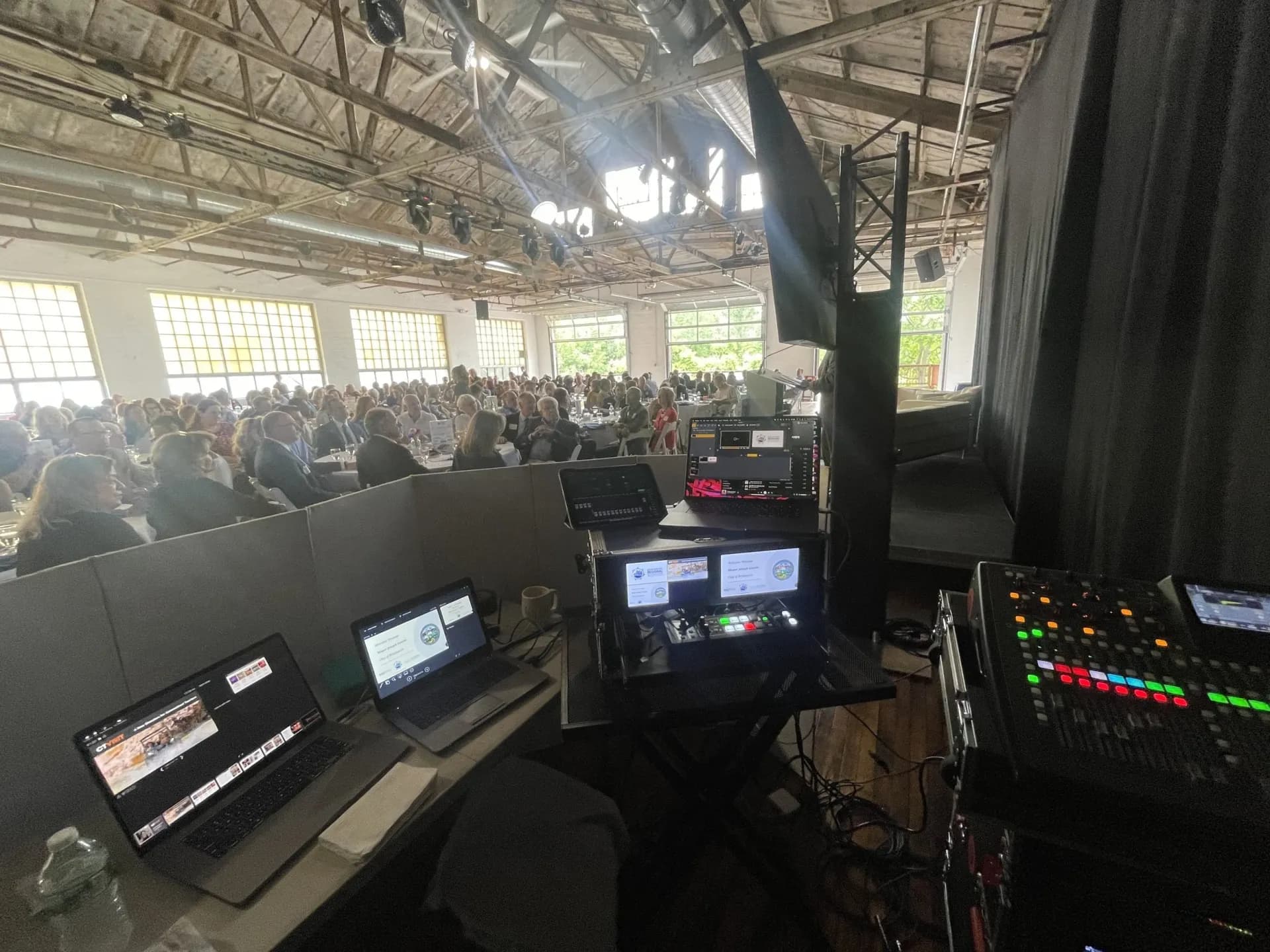 Audio and video control station at a corporate meeting