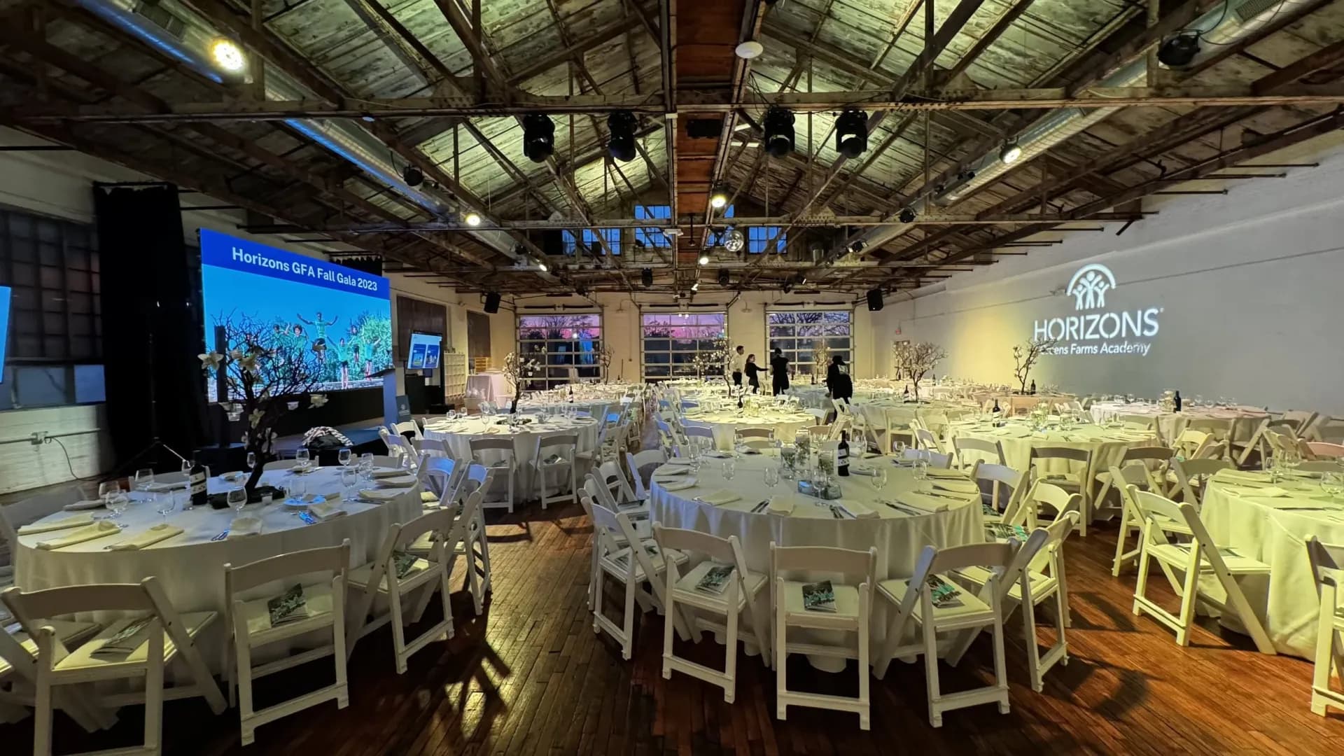 Corporate event production with LED video wall and gobo lighting in a ballroom
