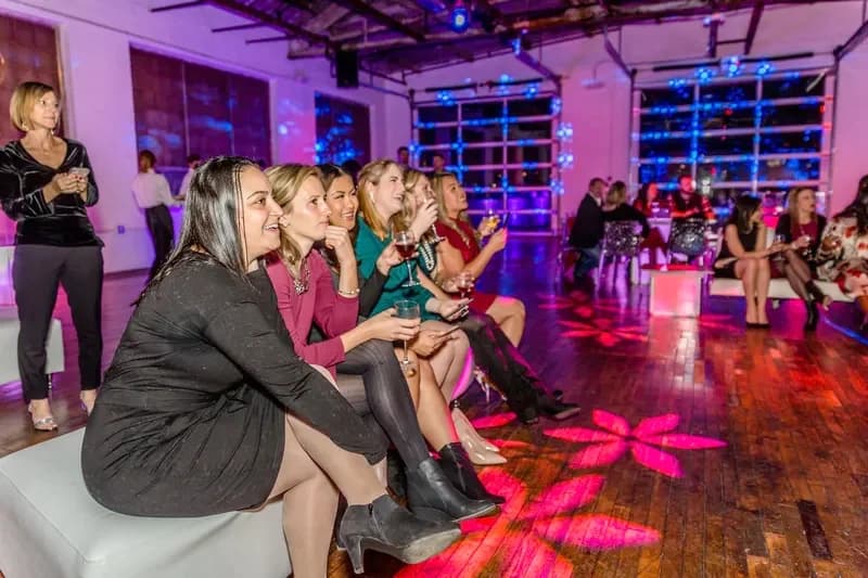 Graduation celebration event with festive lighting and lounge seating