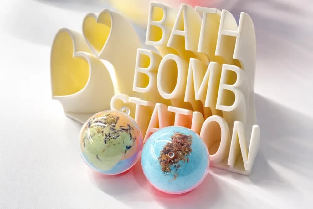Guests blending colorful custom bath bombs with scents at an interactive party beauty and wellness station