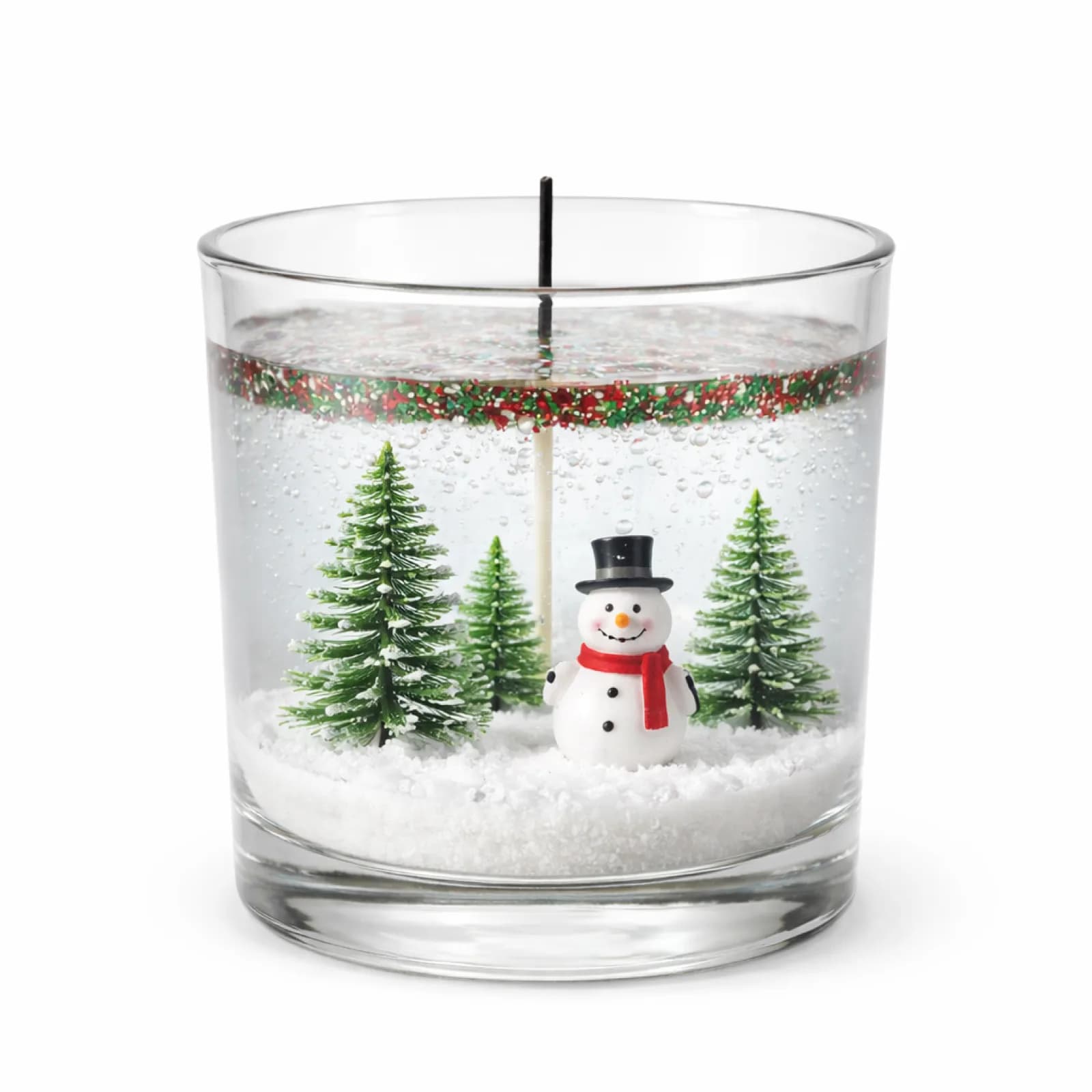 Winter-themed gel candle with a miniature snowman and snow-covered trees inside a glass votive at a candle art station