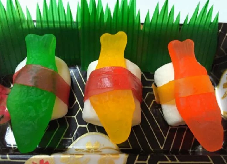 Candy sushi nigiri pieces made from gummy candy on marshmallow rice at a dessert station