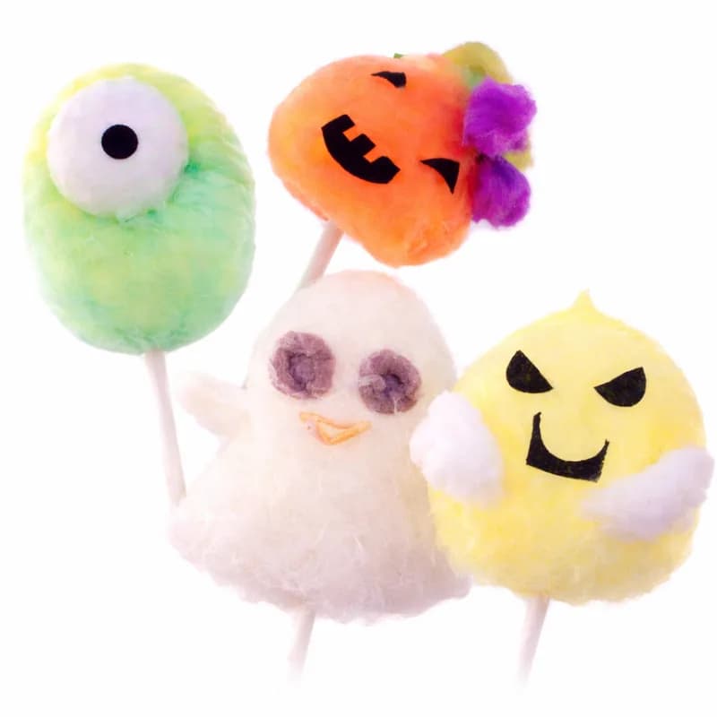 Halloween-themed cotton candy art shaped into ghost, pumpkin, and monster designs for a fall event
