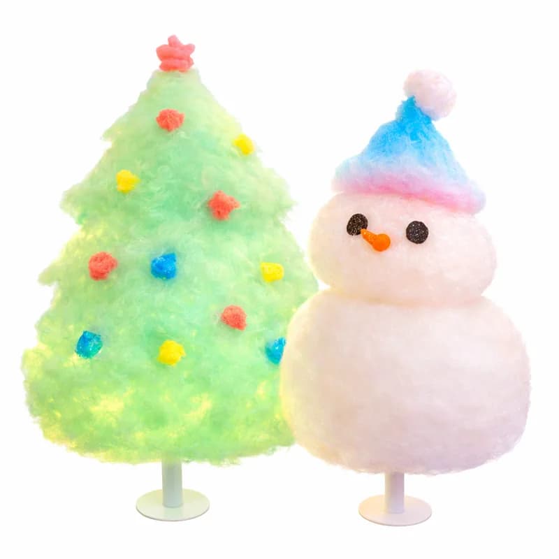 Cotton candy art hand-shaped into a holiday tree and snowman for a winter event