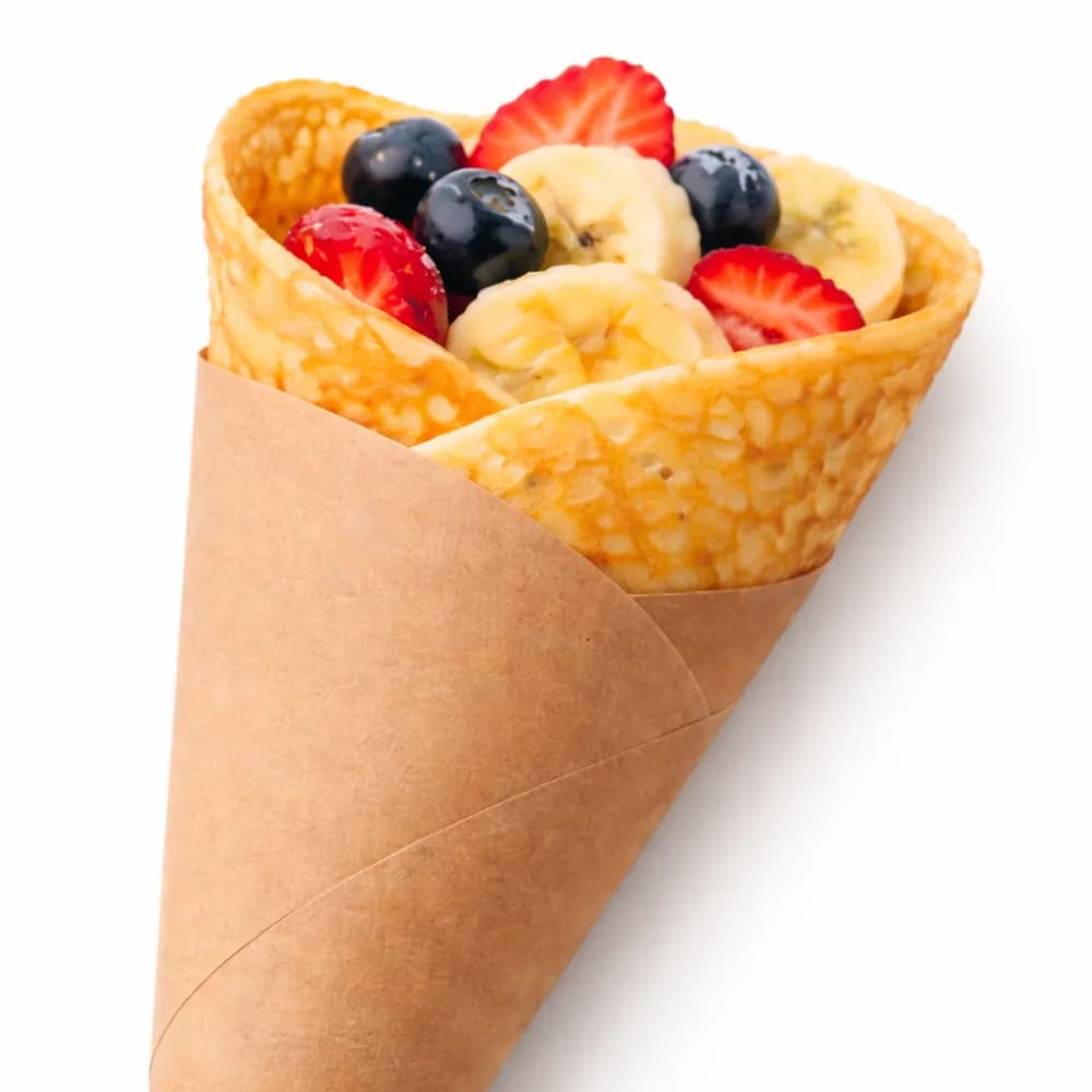 Fresh crepe station with made-to-order crepes and sweet fruit toppings at an event