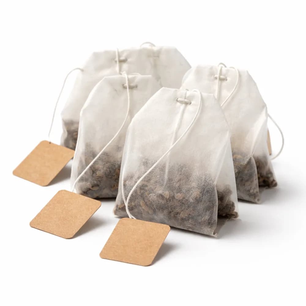 Four finished DIY tea bags with kraft paper tags, a take-home keepsake from the tea blending station