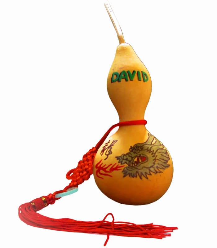 Hand-painted mini gourd charm with a dragon design and the name David, a keepsake from the good fortune keepsakes station