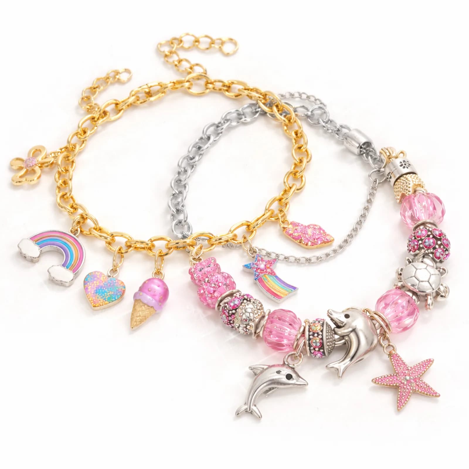 Gold and silver charm bracelets with dolphin, turtle, and starfish charms from a jewelry station