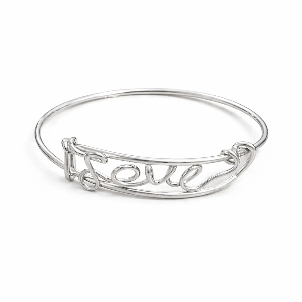 Wire word bracelet spelling out a message, handformed at a jewelry station