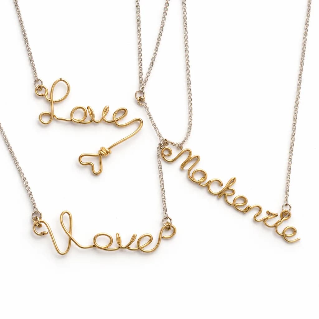 Gold wire name necklaces handformed into script lettering from a jewelry station
