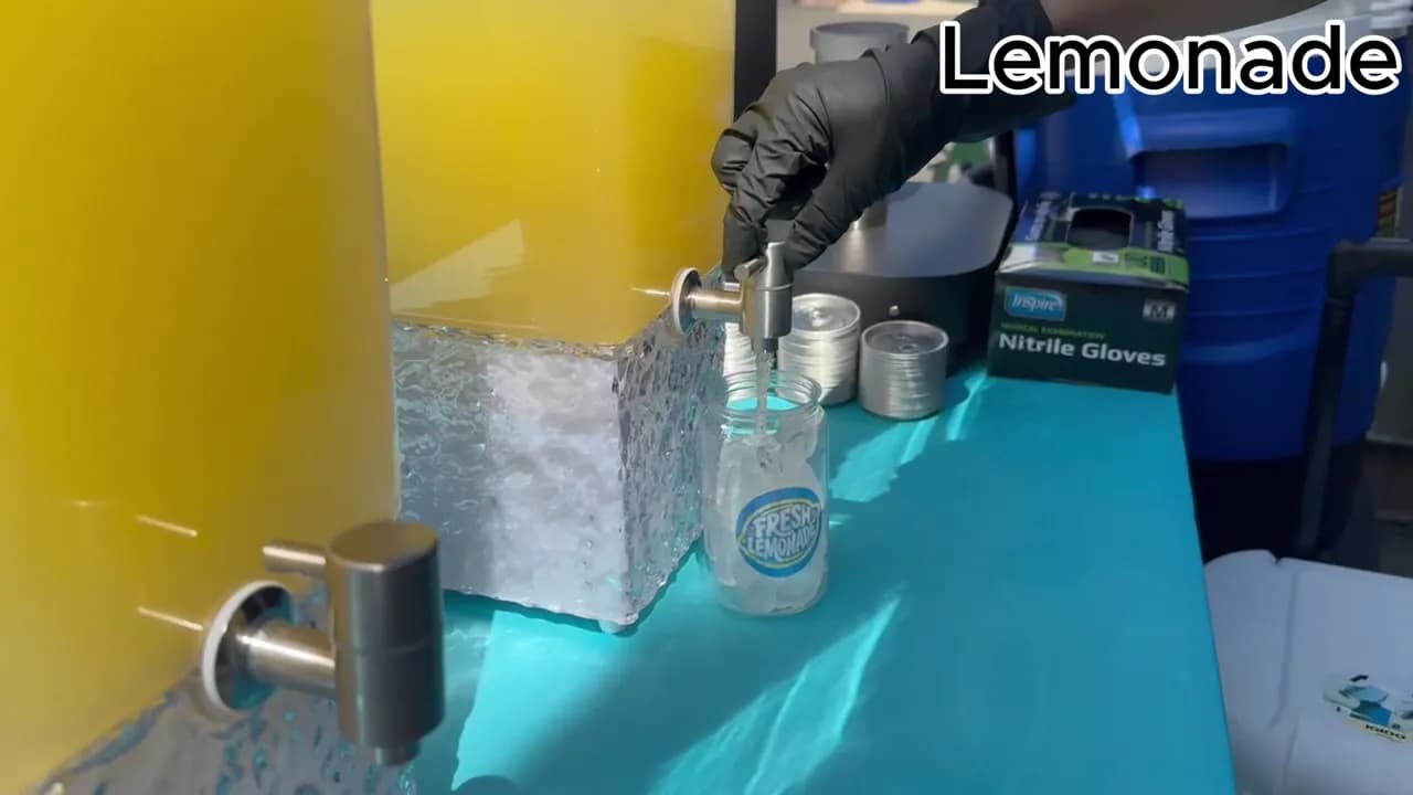 Lemonade station setup with an attendant at a Nicholson Events event