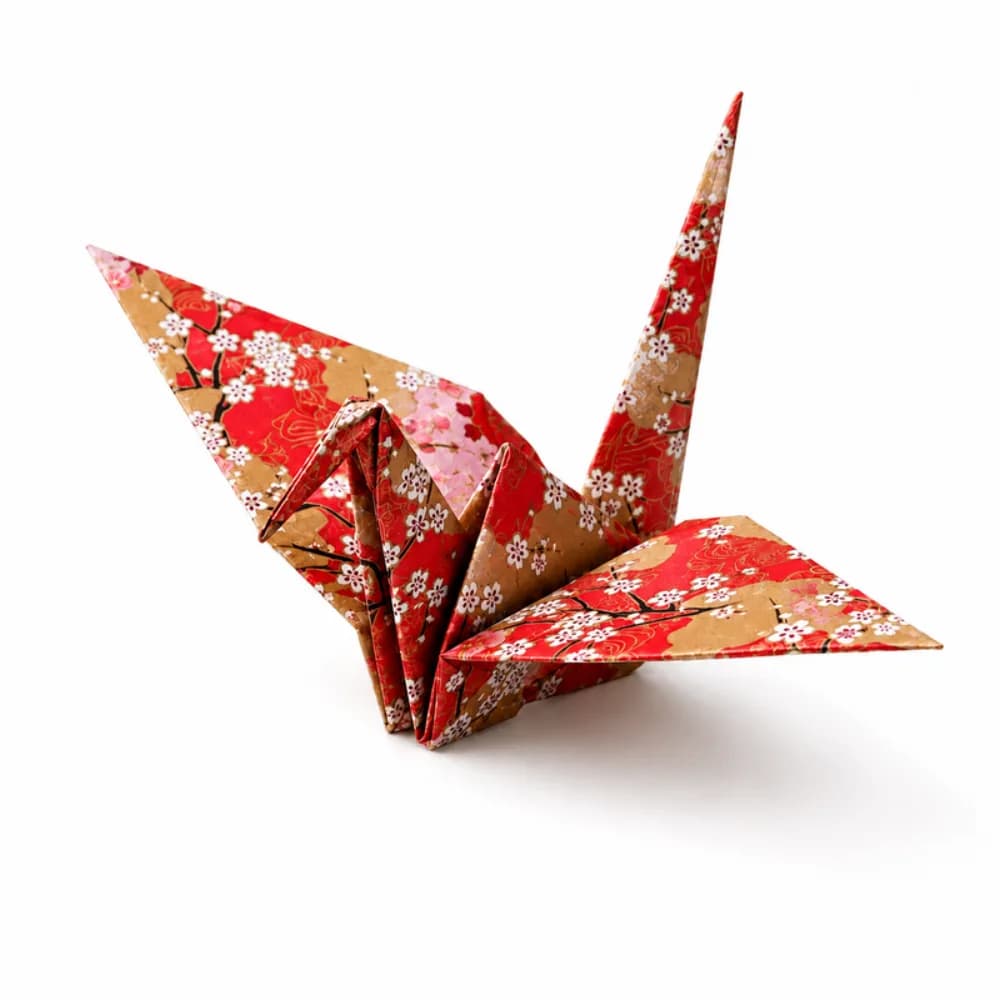 Red and gold cherry blossom origami crane, a folded paper keepsake from the origami station