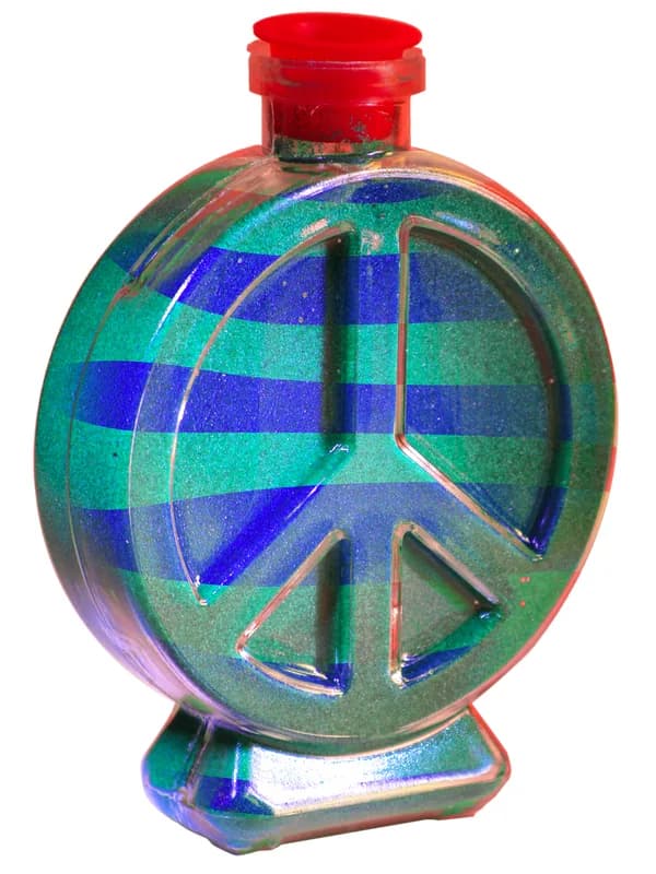 Peace-sign shaped bottle filled with layered blue and green sand at a sand art station