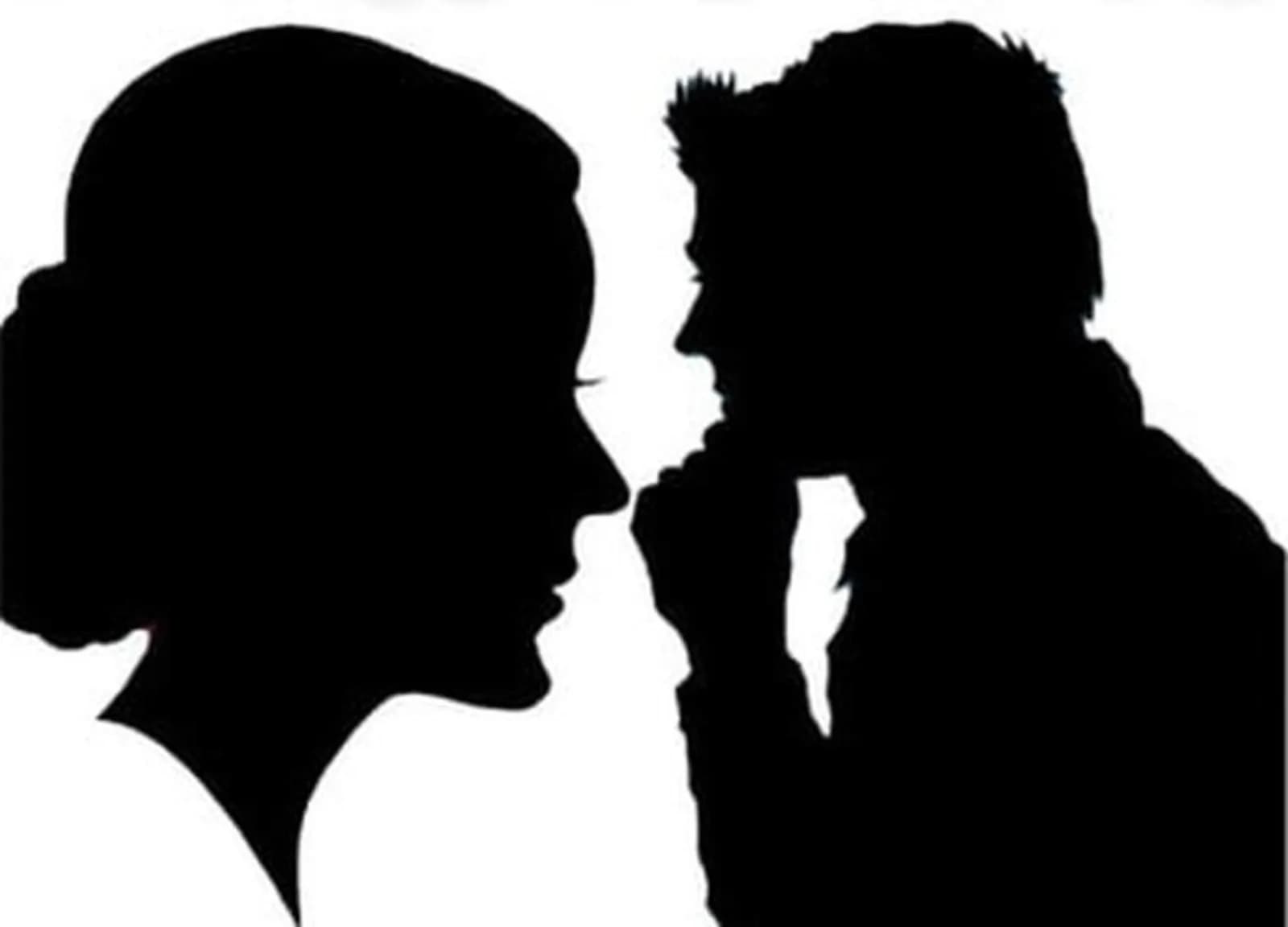 Two hand-cut silhouette portraits in profile facing each other, a classic keepsake from the silhouette station