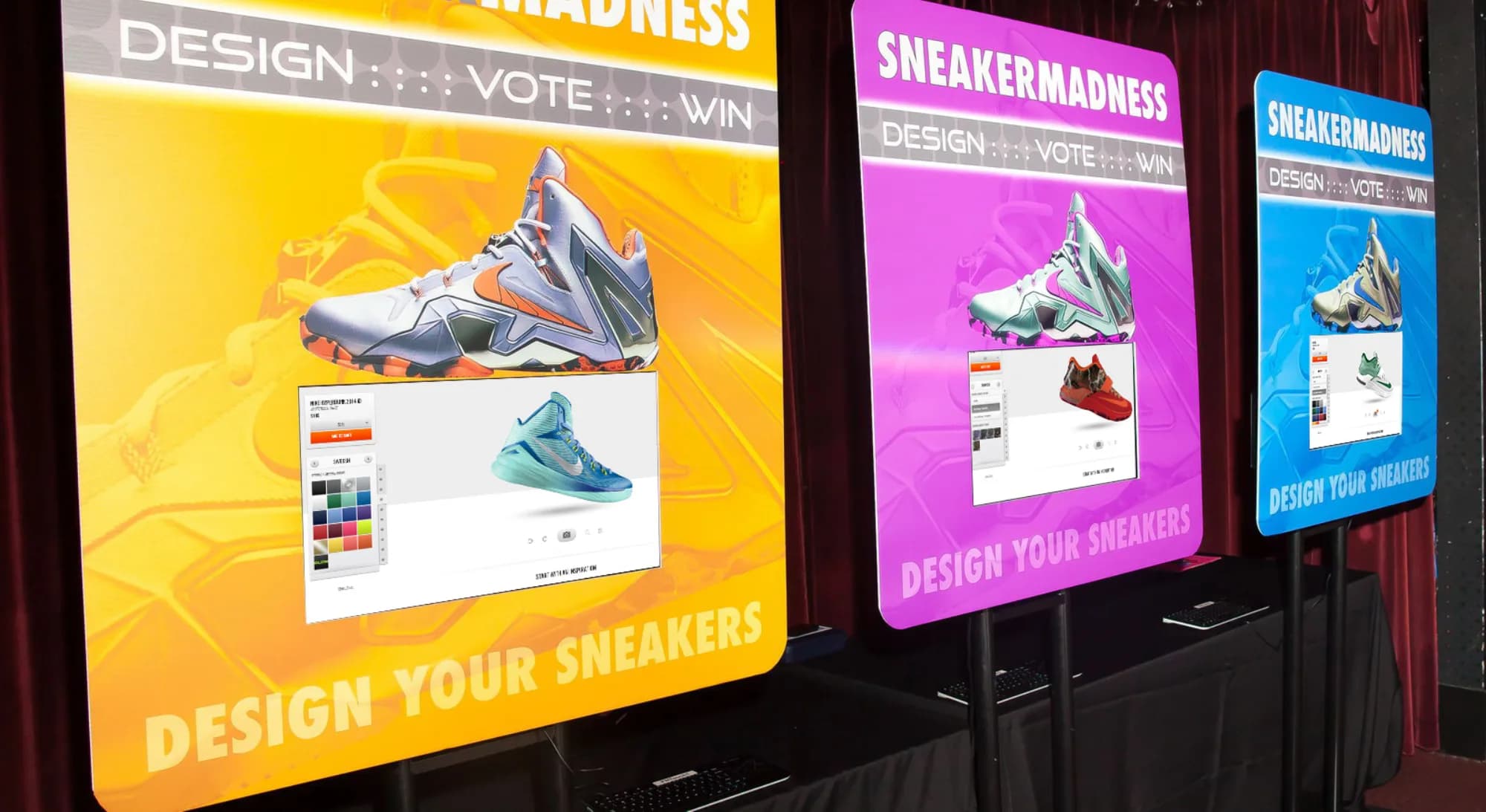 Sneaker Madness design station with three illuminated display boards showing the design, vote, and win interface at a New York event