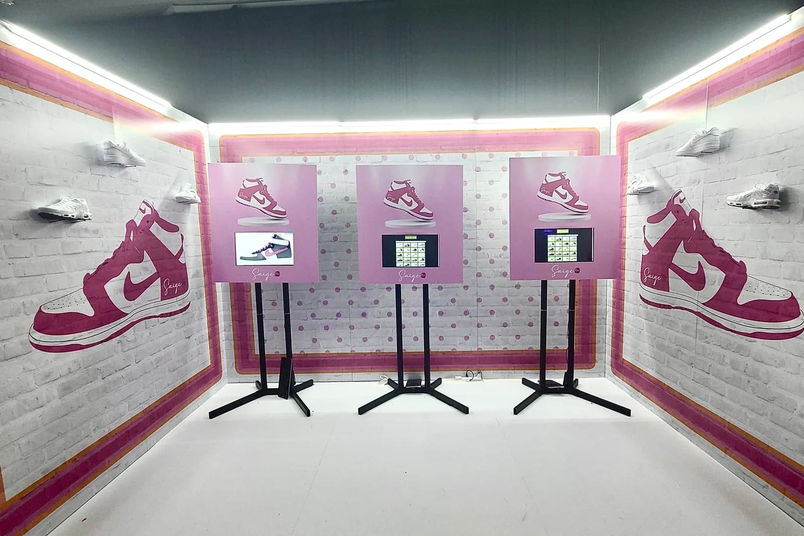 Sneaker Madness kiosk installation with three branded design stations in a custom event color scheme