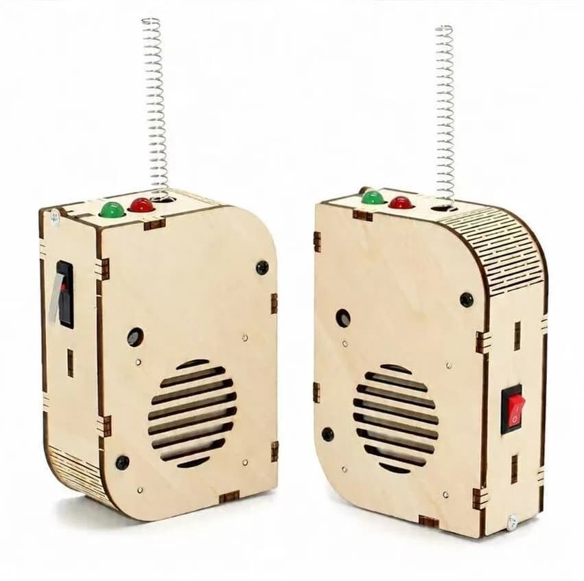 Two hand-built wooden radio STEM kits with working speakers and antennas from a STEM activities station