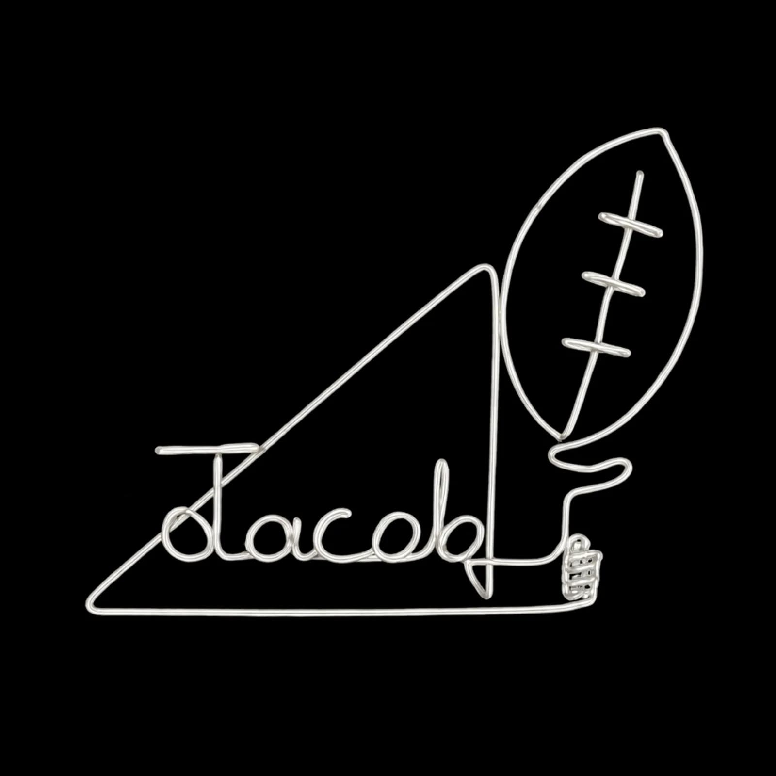 Wire art piece shaping a guest name into a football design, a keepsake from the wire art station