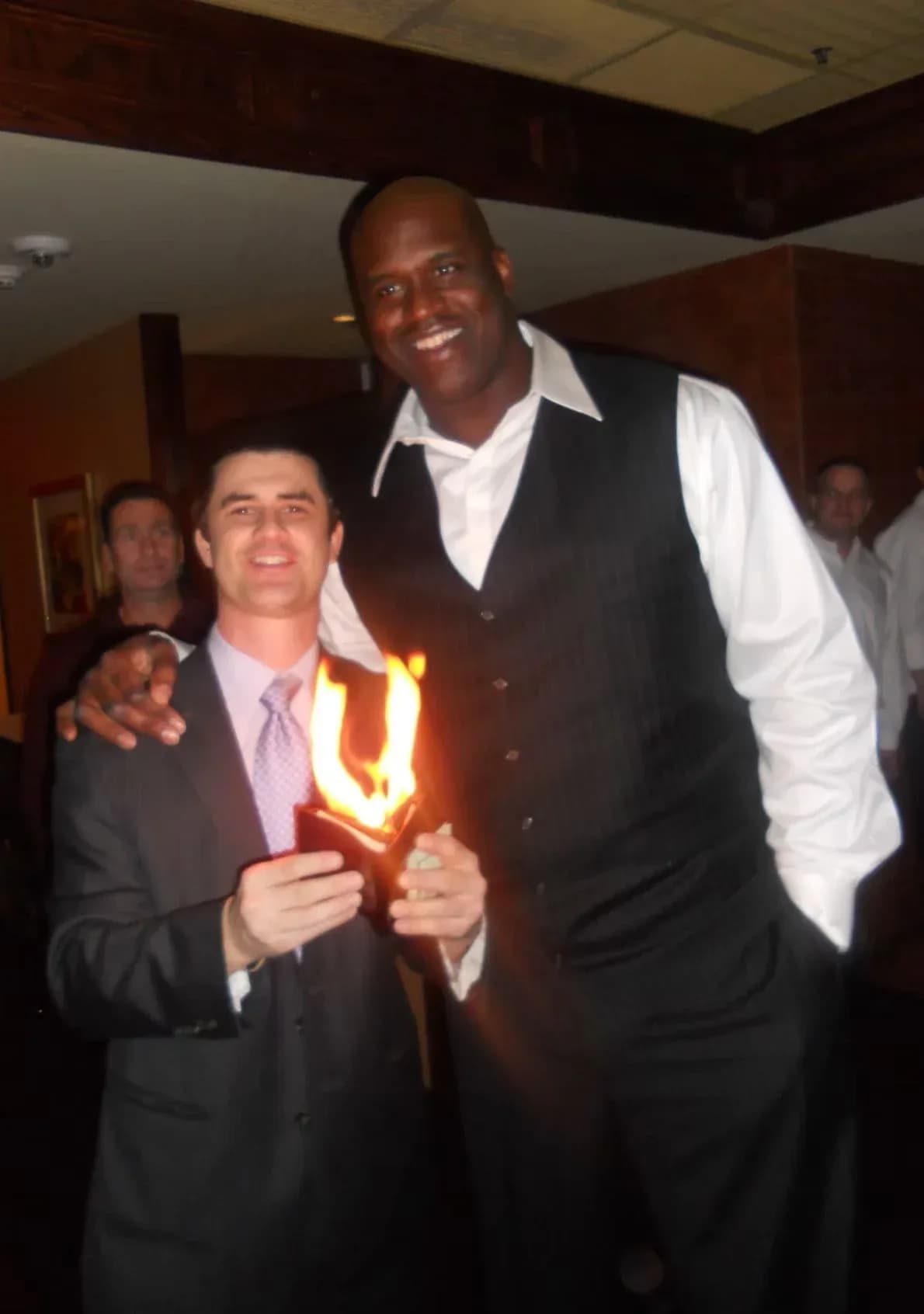 Mentalist Ken Salaz performing a fire effect with Shaquille O Neal