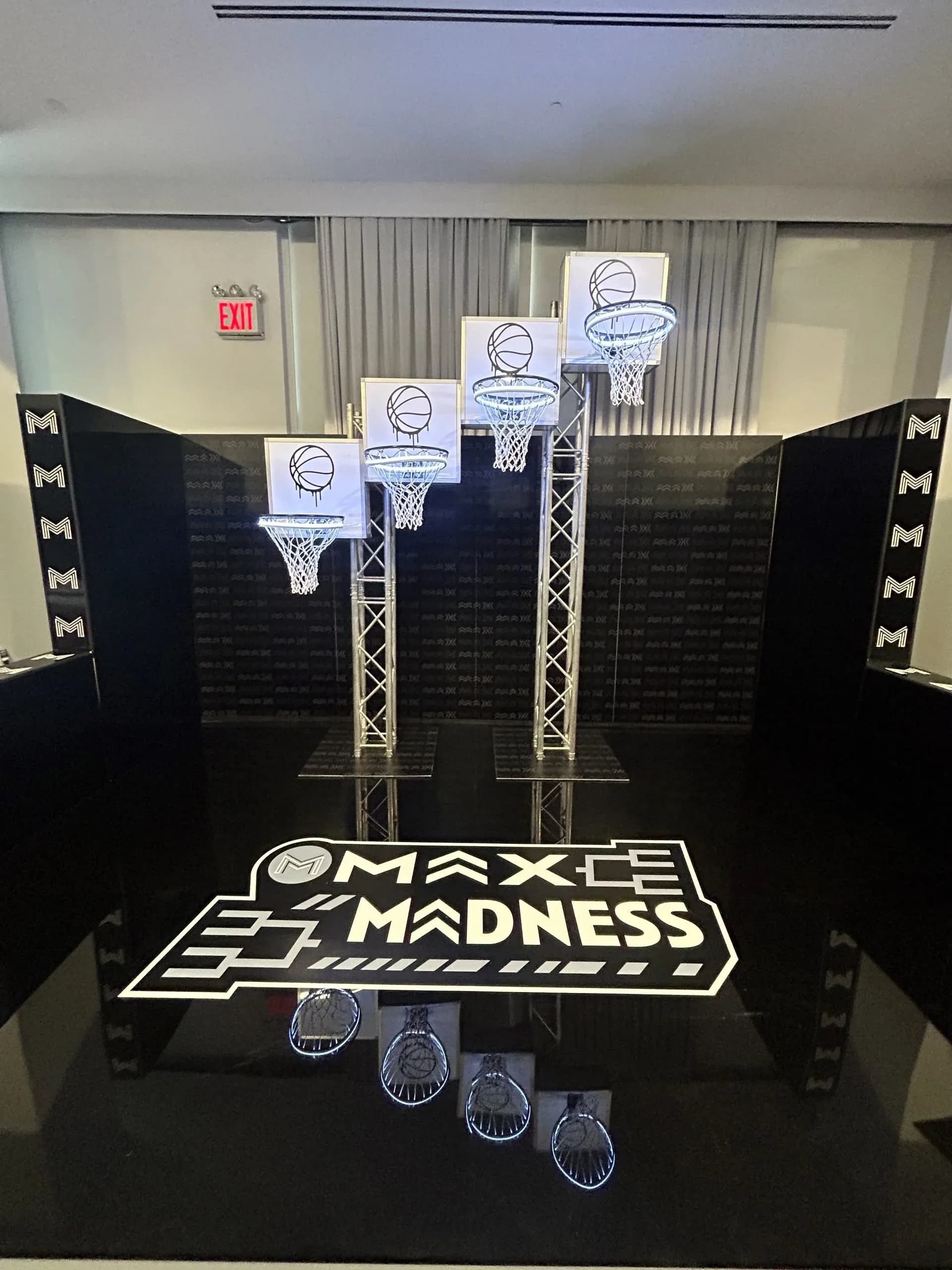 Level up basketball activation with illuminated hoops mounted at varying heights on a custom truss, a sleek interactive game at an event in NYC