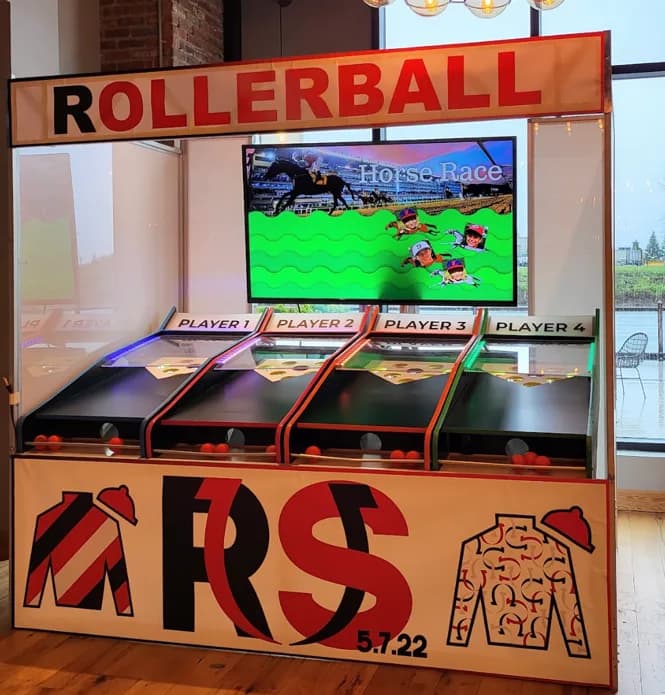 Close-up of the roller ball game character race display screen at a wedding or bar mitzvah event in Connecticut