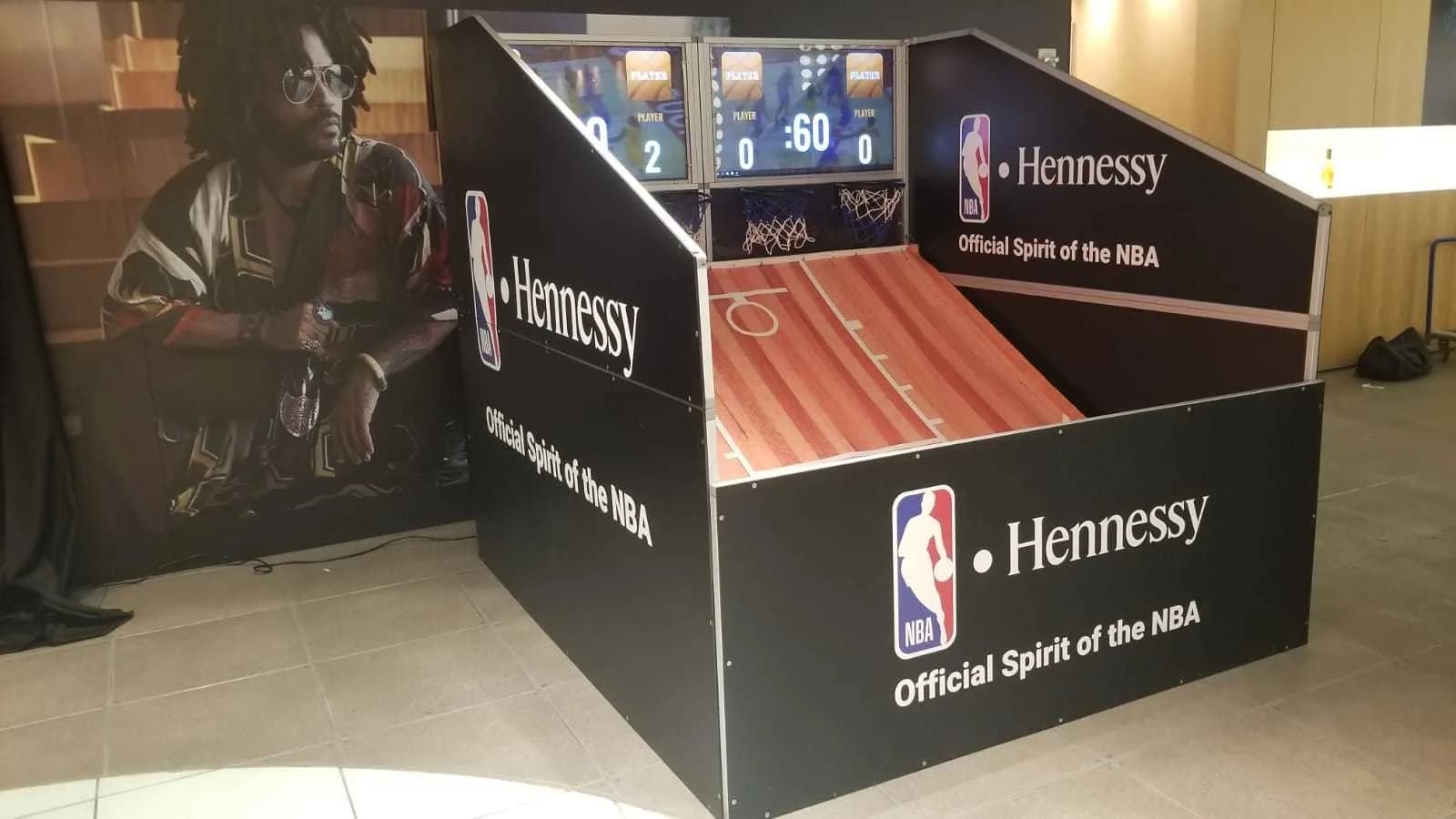 Guest shooting hoops at the social hoops basketball game station during a mitzvah party or corporate event in NYC