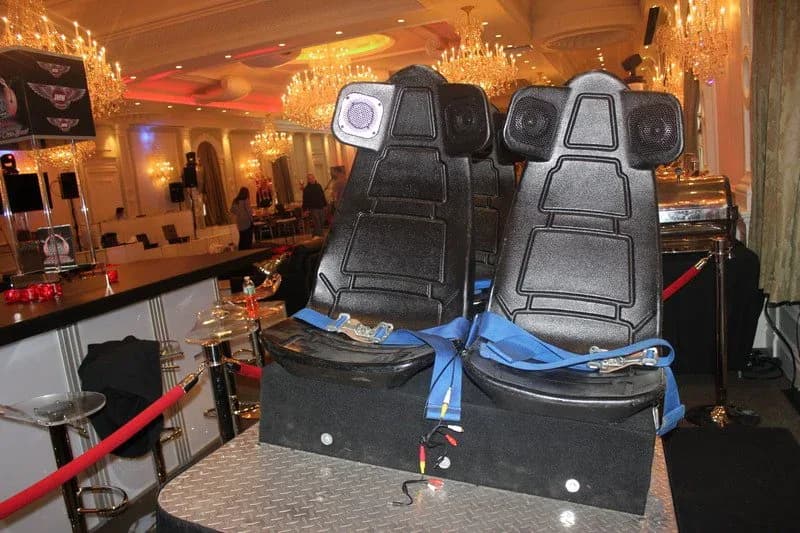 VR coaster motion seats set up in an upscale ballroom at a bar mitzvah or corporate event, a 4-seat virtual reality thrill ride