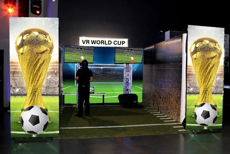 VR soccer goalie game at a corporate event or bar mitzvah, guest wearing VR headset defending the virtual goal in immersive sports simulation