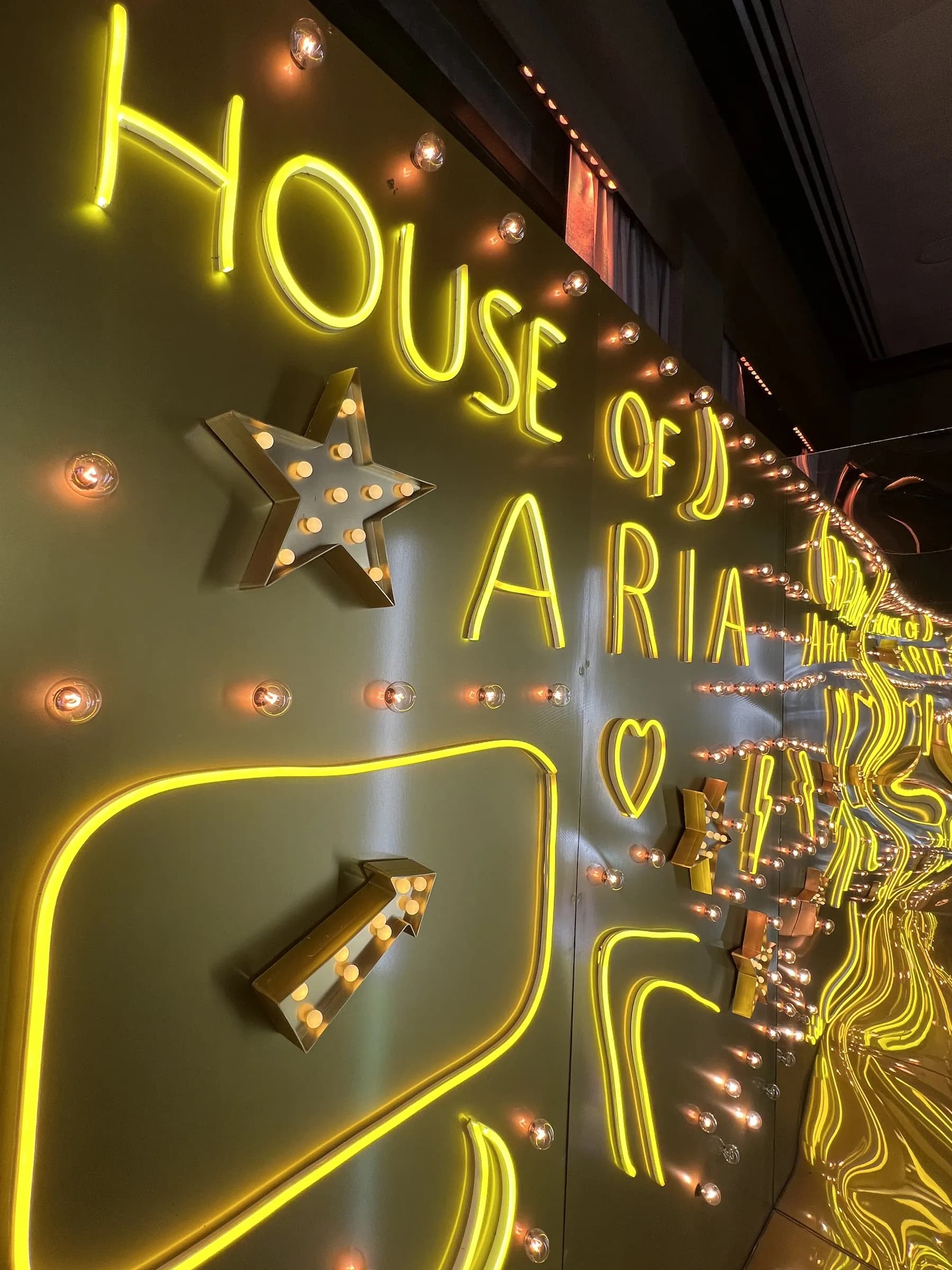 Group photo in the immersive Gold Neon Room experience