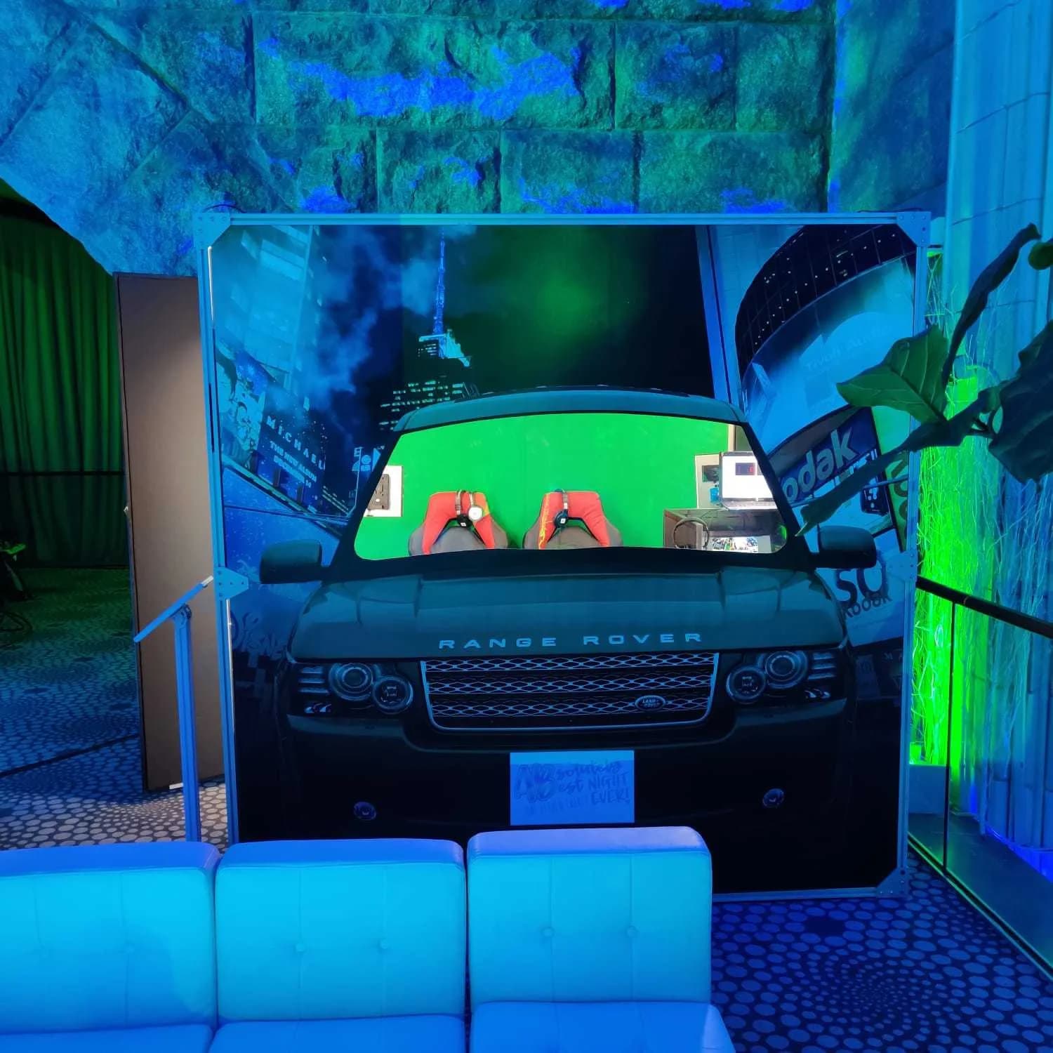 Front view of car facade booth with green screen visible through windshield at a Nicholson Events celebration