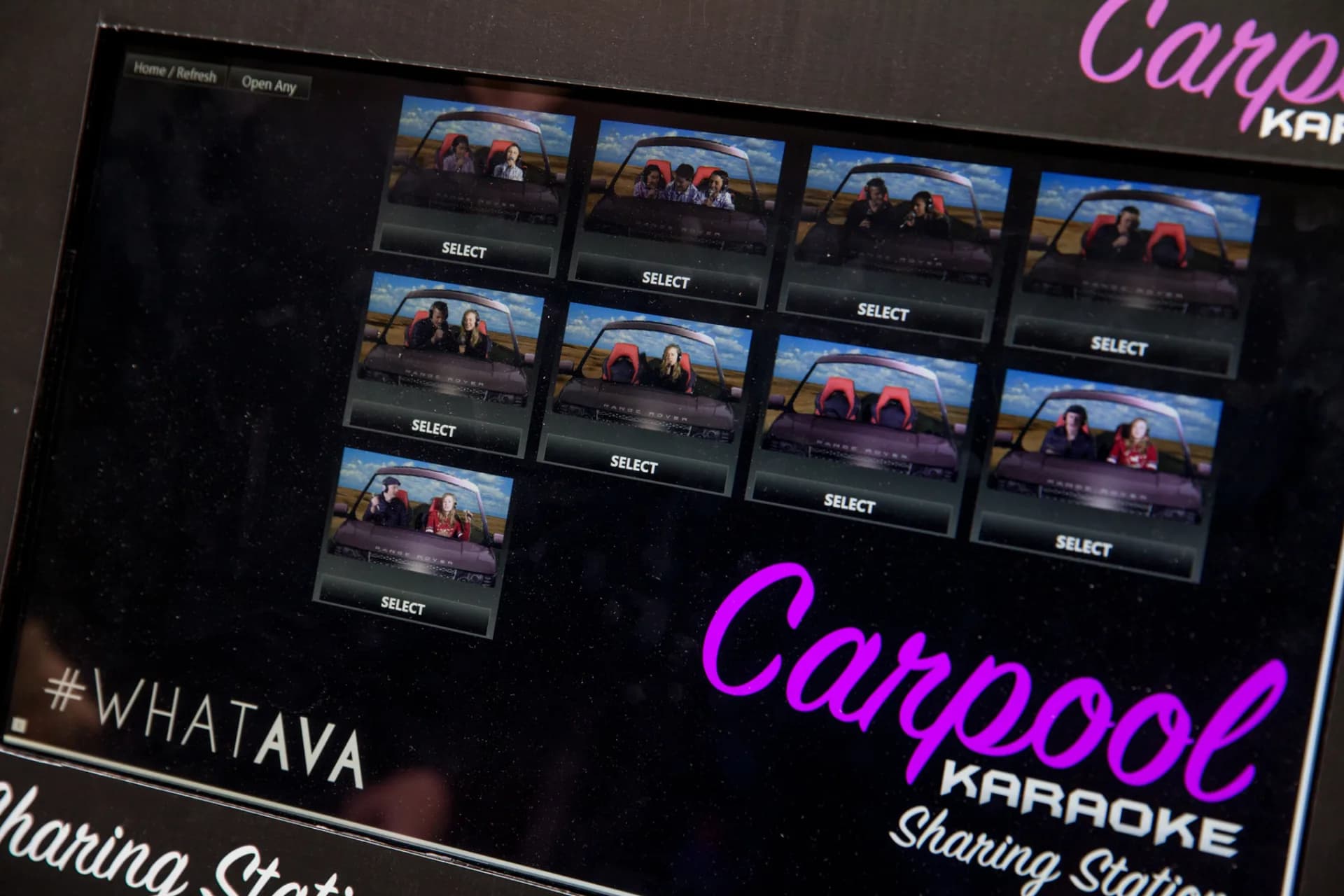 Sharing station displaying guest video thumbnails from the car booth karaoke experience