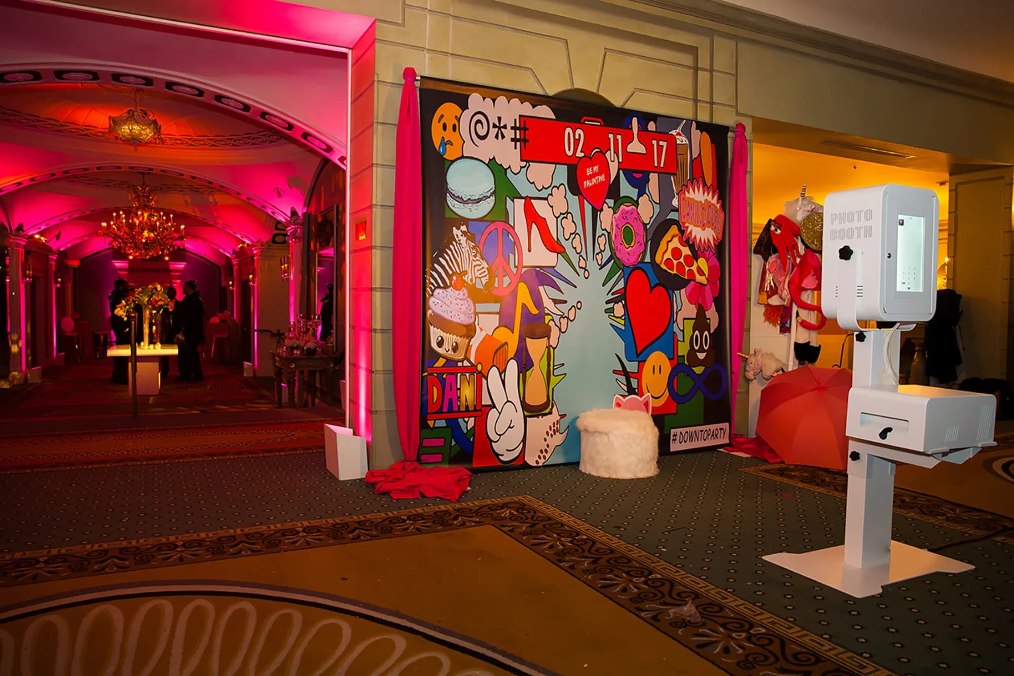 Photo kiosk booth station set up alongside a colorful custom graffiti-art backdrop at a bar mitzvah celebration
