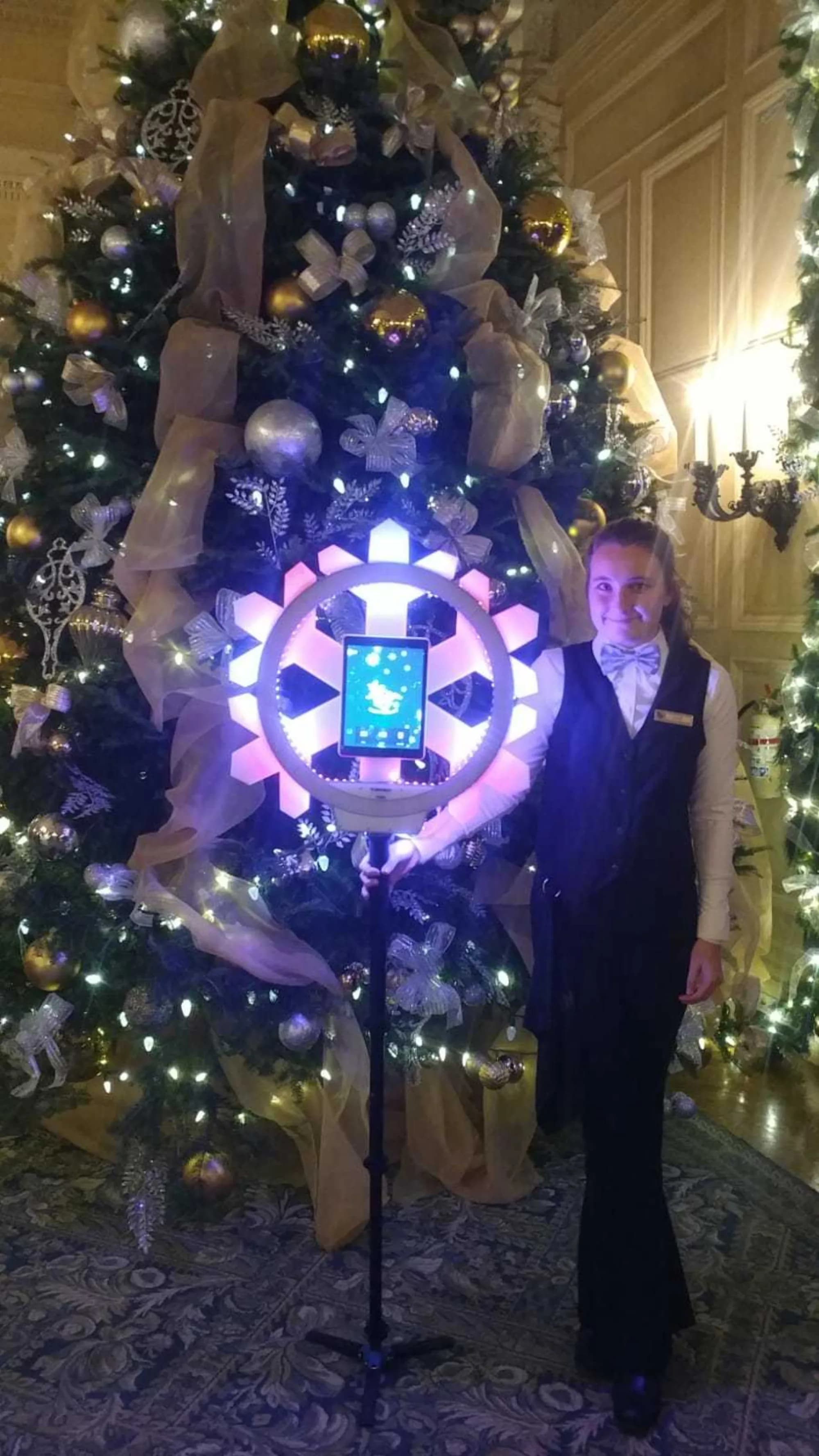 Snowflake-themed roaming photo ring light setup at a winter holiday event