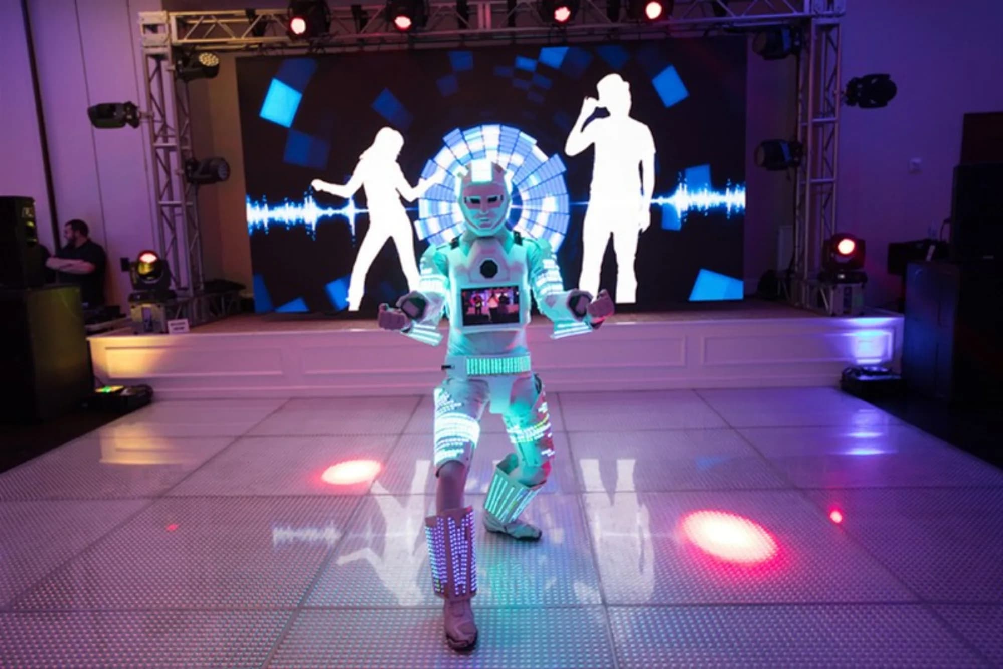 Photo-bot roaming attendant in LED robot costume at a corporate event venue