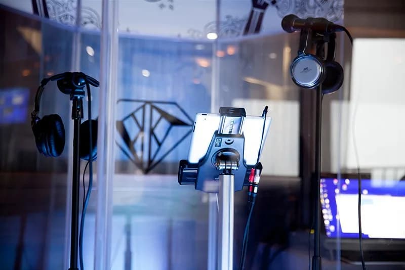 Professional microphone and ring light setup inside a video booth at a corporate event