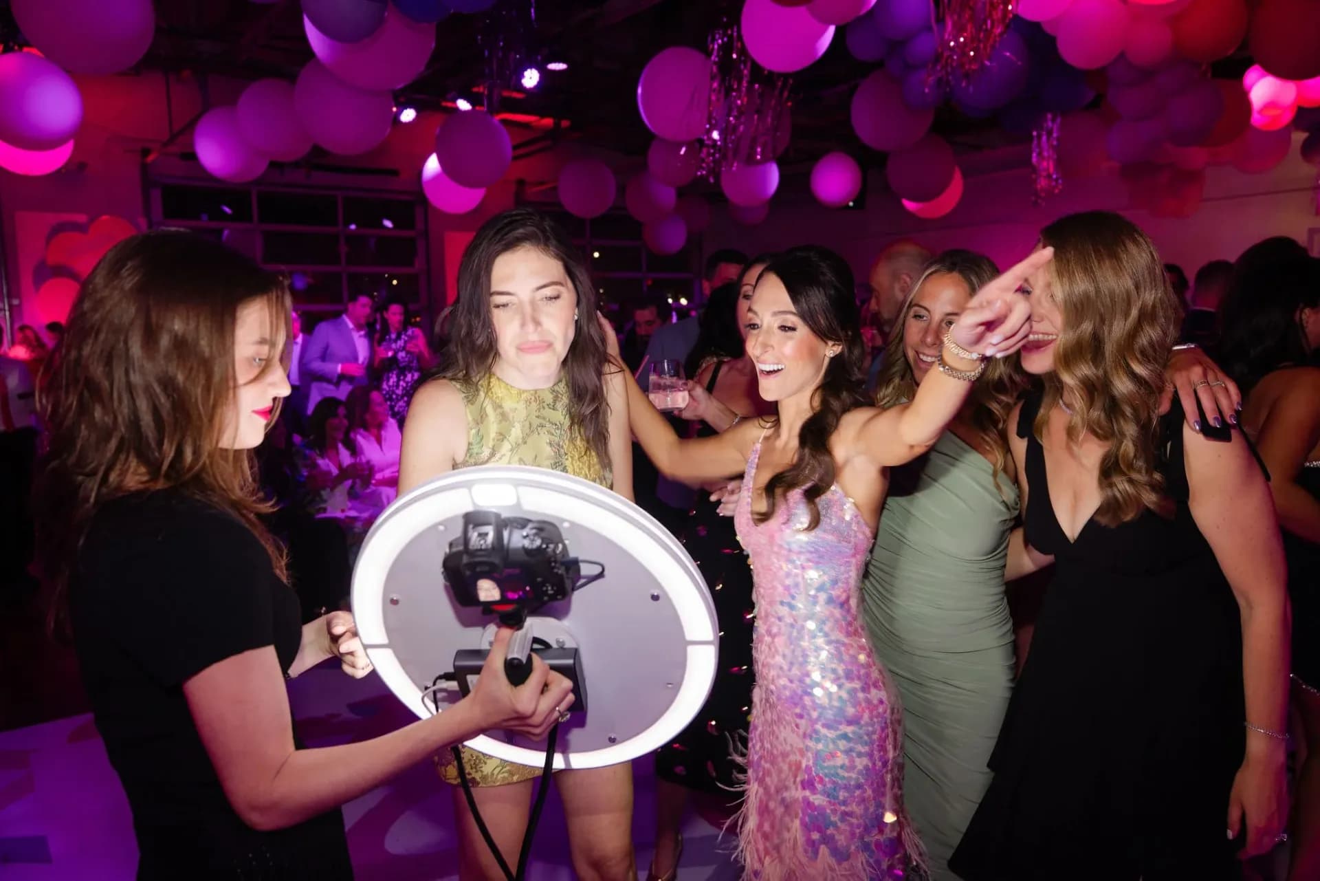Roamer photo booth attendant capturing guests at a luxury party in Connecticut with LED ring light