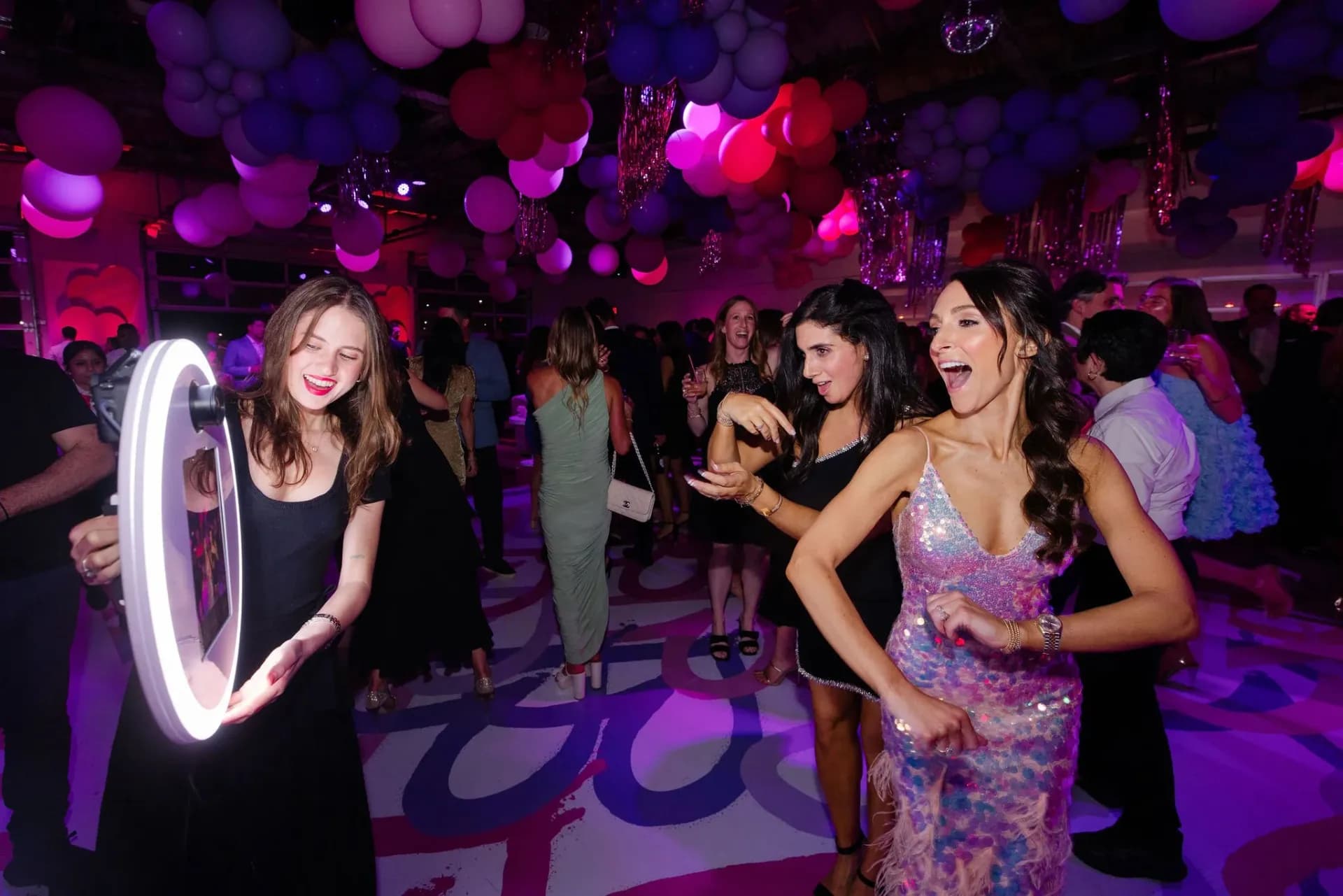 Roamer photo booth capturing candid moments on the dance floor at a mitzvah celebration
