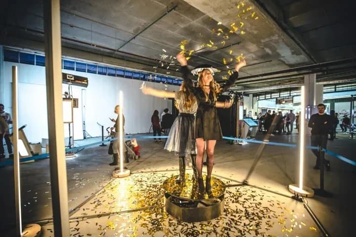 Guests on a 360 spin platform with confetti at a Nicholson Events celebration in New York