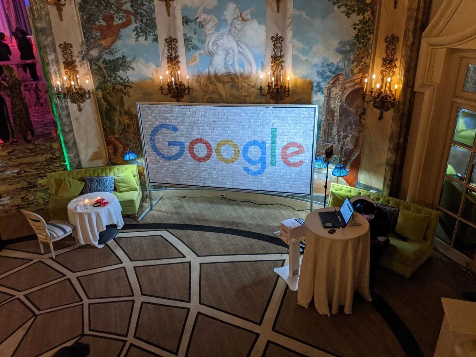Live event photo mosaic display showing guest photos assembled into a corporate brand logo at a gala