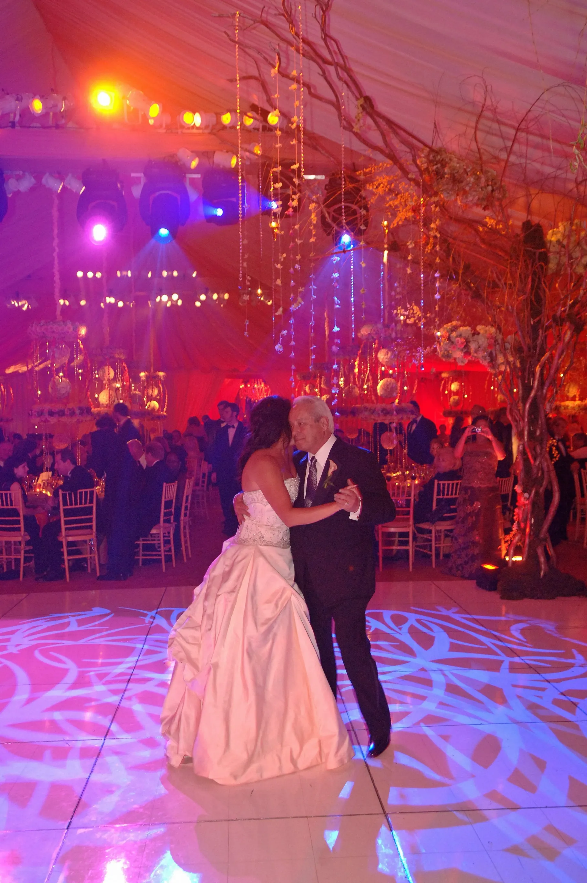 Custom monogram dance floor and first-dance lighting designed by a Nicholson Events wedding planner