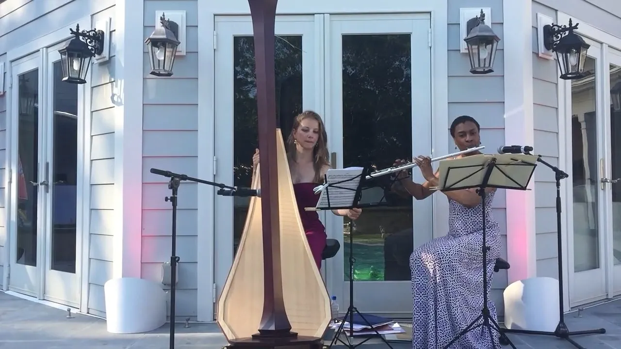 Harp and flute duo performing at an al fresco cocktail hour at a Hamptons summer party