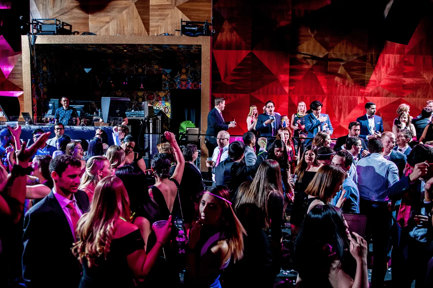 Corporate holiday party DJ working a packed dance floor at a New York City venue for Nicholson Events