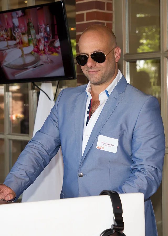 Professional wedding DJ running the night from the decks so the couple can enjoy their wedding, for Nicholson Events