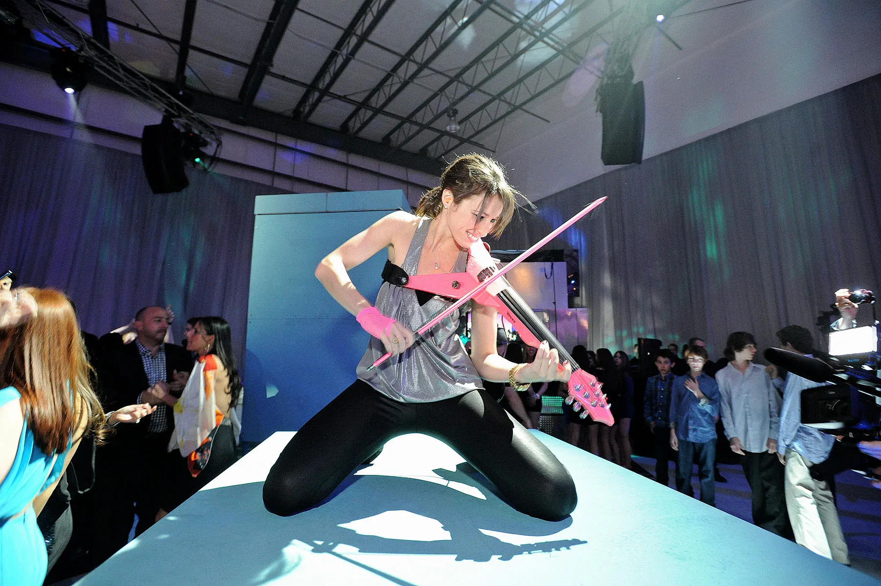 Electric violinist performing during a refined wedding designed by a Nicholson Events planner